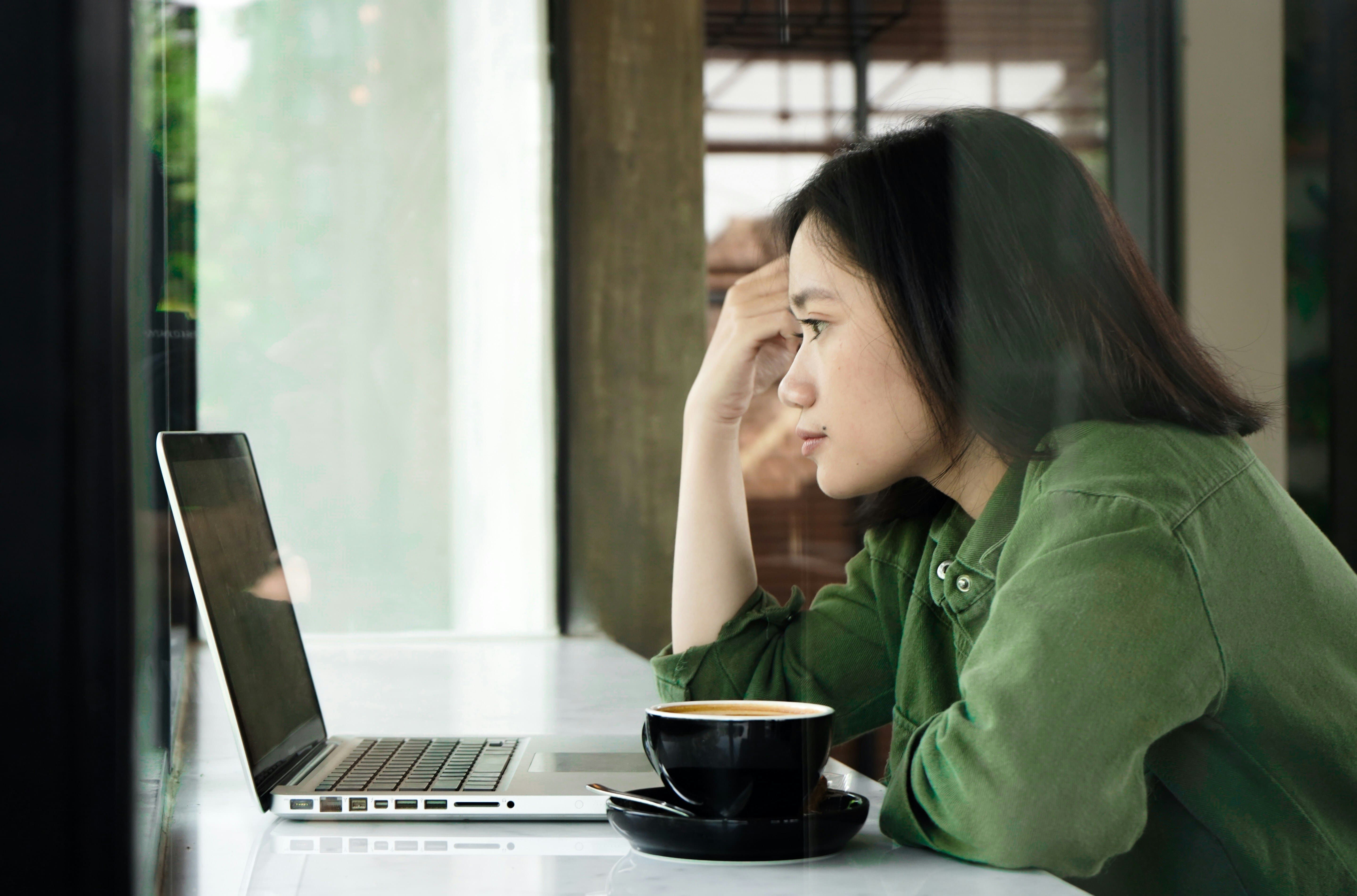 woman looking at a laptop - Runway ML
